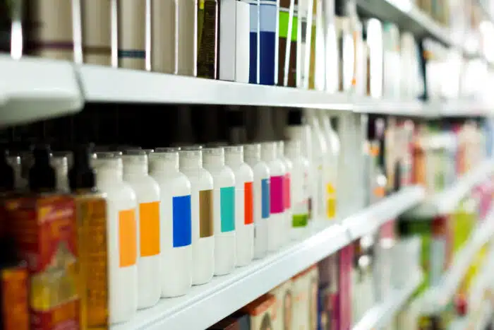 Cosmetic section with conditioners, shampoo and hair treatment in store.