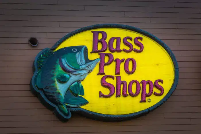 A Bass Pro Shops Logo outdoor wall sign - class action, socks, lifetime warranty