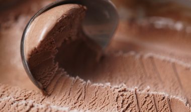 scooping chocolate ice cream close up shot, shallow focus