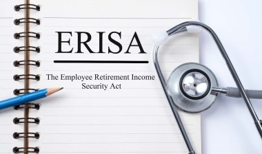 Stethoscope on notebook and pencil with ERISA (The Employee Retirement Income Security Act) words as medical concept. RWJBarnabas Health settlement