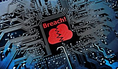 Close up of motherboard with word that reads: ‘breach’