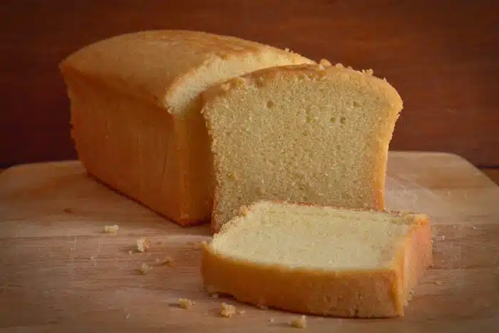 Homemade sliced buttercake on wooden background - Sara Lee settlement