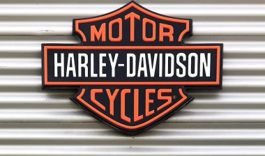 Harley Davidson signage against a metal backdrop.