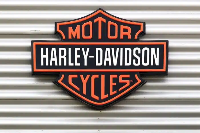 Harley Davidson signage against a metal backdrop.