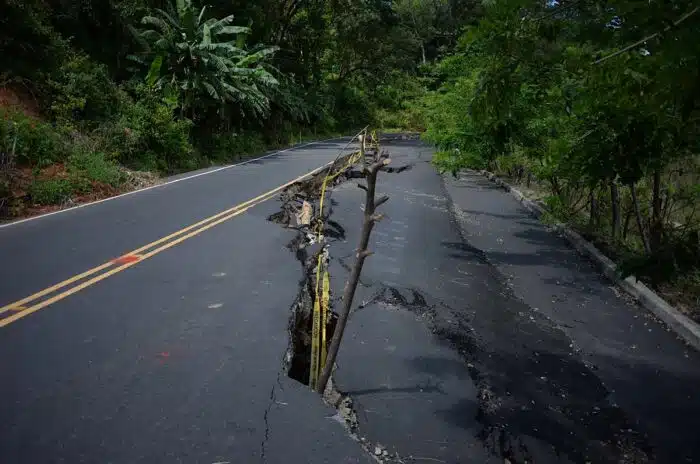 Earthquake-damaged street with a creepy crack in the middle - oklahoma settlement