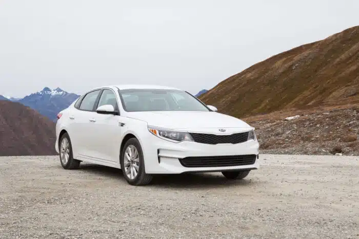 White Kia Optima in Mountains of Alaska.