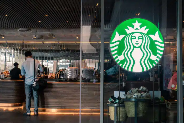 Starbucks coffee logo in front of the shop, representing the Starbucks Refresher class action lawsuit