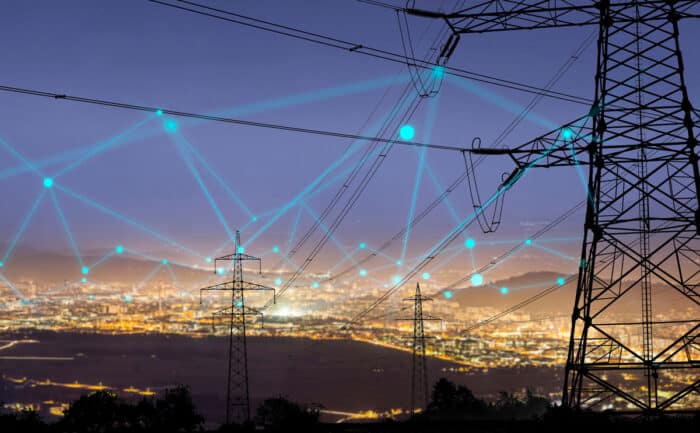 High power electricity poles in urban area connected to smart grid.