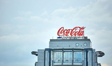 Coca-Cola advertising on the roof of a building in the city center.