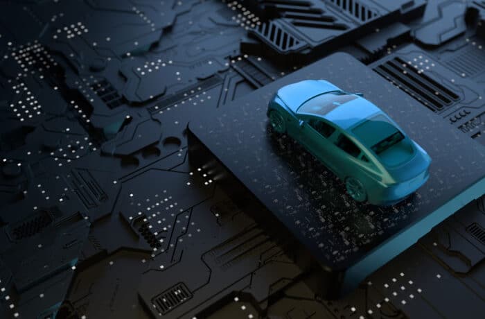 Close up of a mini vehicle on top of a motherboard.