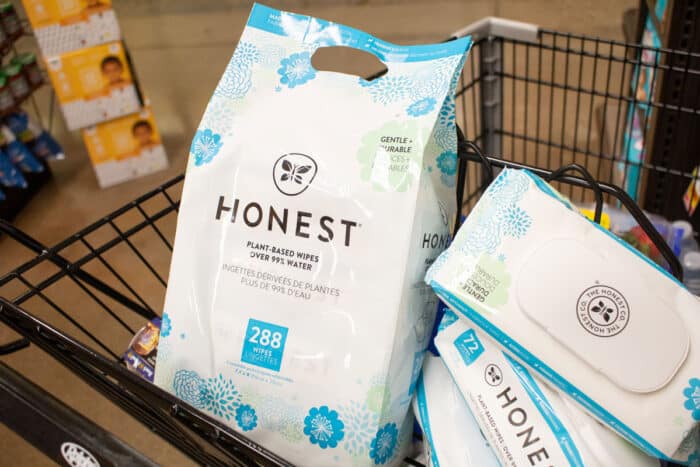 A view of Honest Company products inside a shopping cart, featuring plant-based baby wipes.
