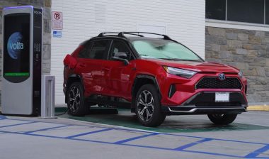 Image of a Toyota RAV4 plug-in hybrid suv shown recharging.