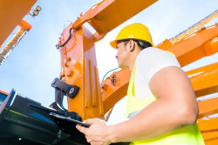 Worker controlling construction machinery - PAGA