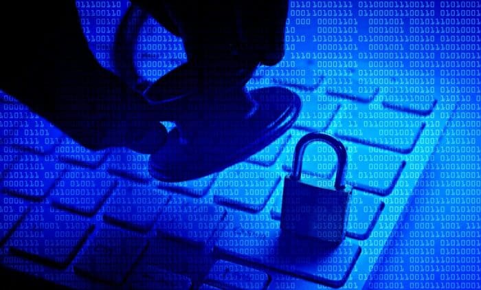 Medical data breach concept, hand holding stethoscope over lock on keyboard - salinas valley memorial healthcare system