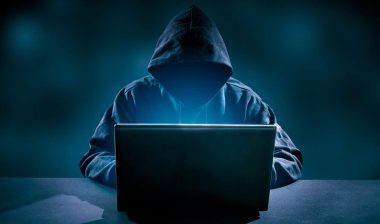 Hacker using laptop. Hacking the Internet.