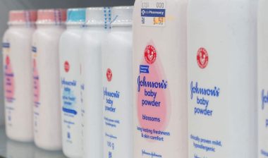Photos of Johnsons baby powders on a supermarket shelf.