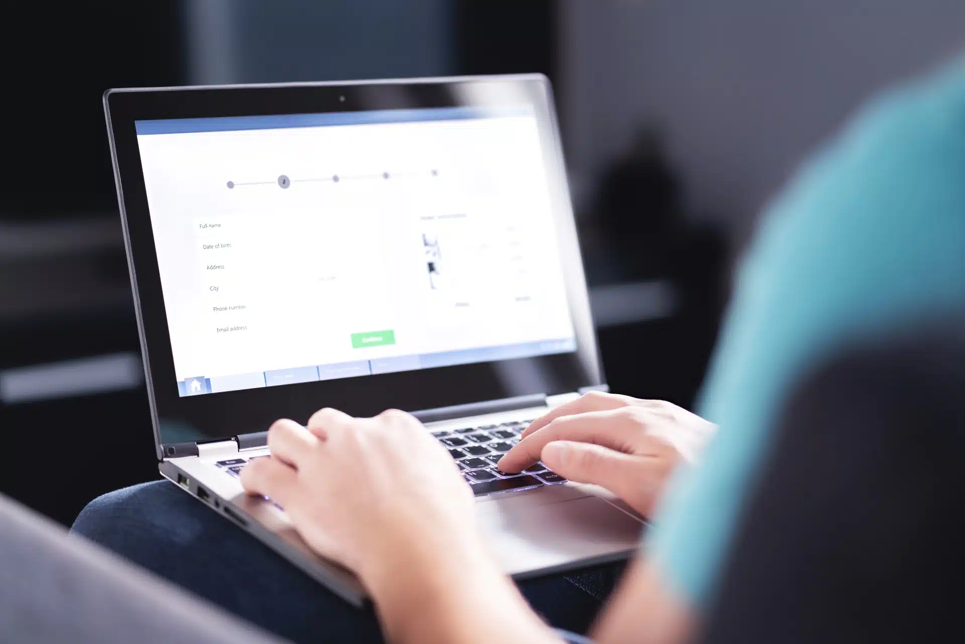 A person using a laptop fills out an online form - settlements closing