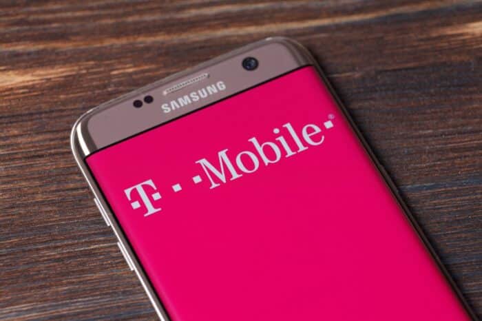 A Smartphone screen shows logo of T-Mobile - data breach class action settlement