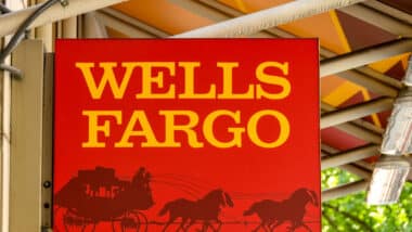 Close up view of the sign outside the entrance to a branch of the Wells Fargo bank in Seattle city centre.