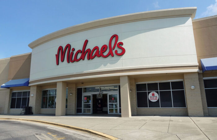 Exterior of a Michales store against a blue sky.