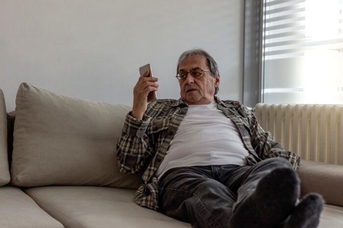 Senior man receiving unwanted call - Shellpoint debt-collection settlement, class action lawsuit