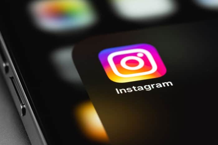 Close up of Instagram app on the screen of a smartphone.