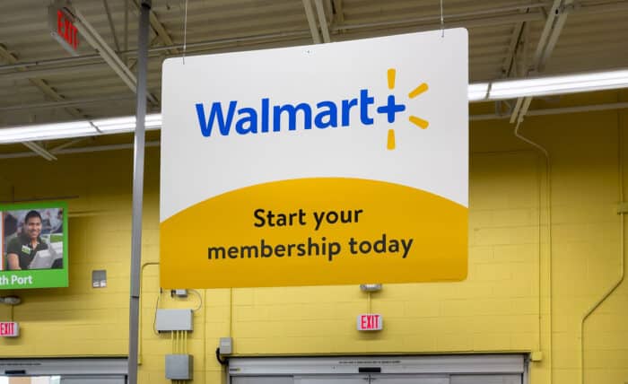 Walmart + membership in store sign.