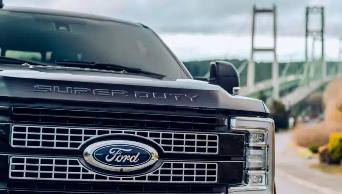 Ford F350 parked with the Tacoma Narrows Bridge in the background