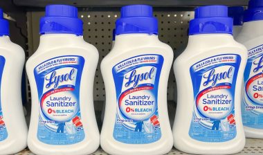 New Lysol Laundry Sanitizer bottles on the shelf in a supermarket.