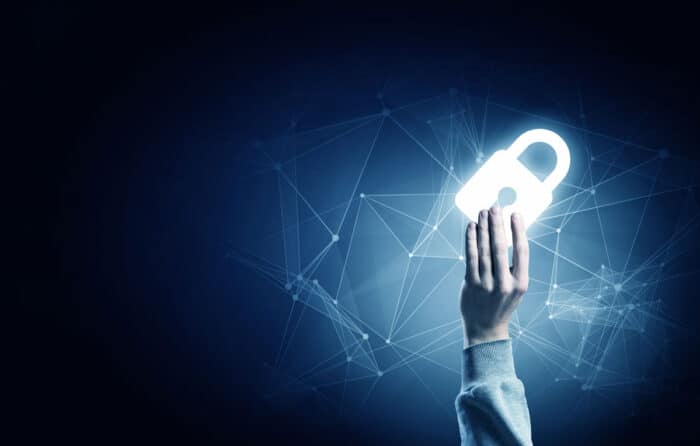 Hand of businessman on dark background with security glowing sign - ClearBalance data breach class action lawsuit settlement