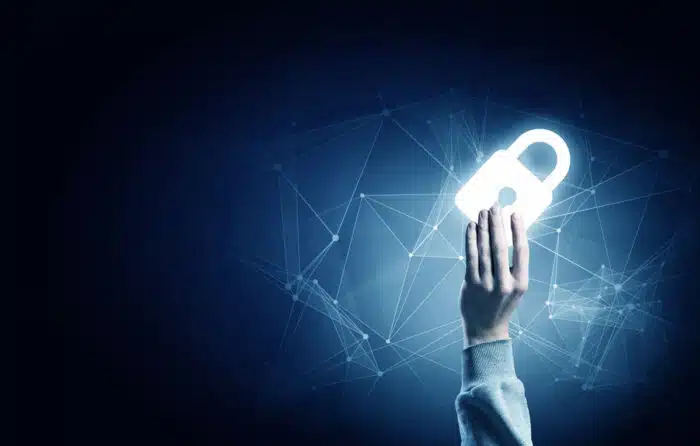 Hand of businessman on dark background with security glowing sign - ClearBalance data breach class action lawsuit settlement