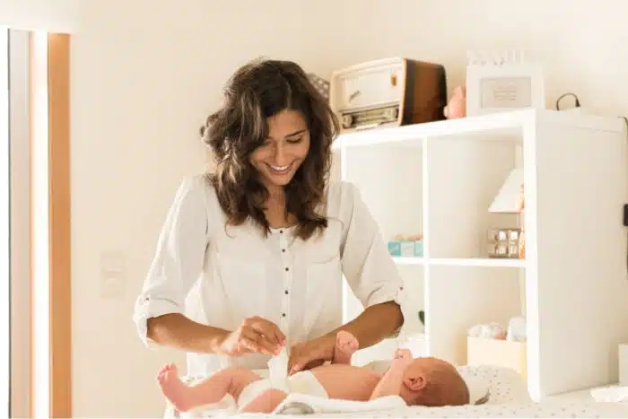 Mother changing a diaper on baby, Healthybaby diapers