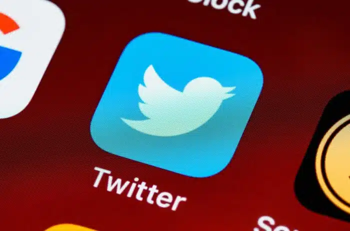 Close up of Twitter app being displayed on the screen of a smartphone.