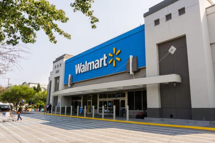 Exterior of a Walmart store against a blue sky.