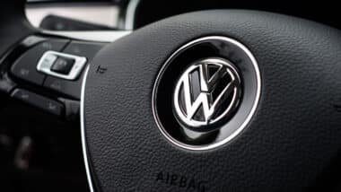 Volkswagen close up logo on steering wheel.