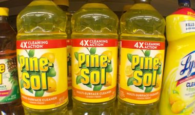 Close up of Pine-Sol bottles on a supermarket shelf.