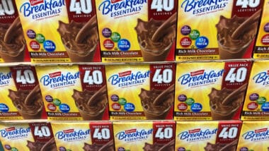 Boxes of chocolate Carnation Instant Breakfast Essentials by Nestle on sale at a Costco Warehouse store.