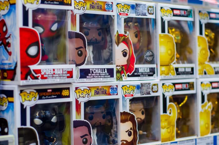 Close up of Funko toys on a grocery store shelf.