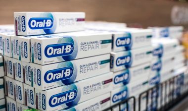 Oral-B toothpaste on display at an aisle in a supermarket.