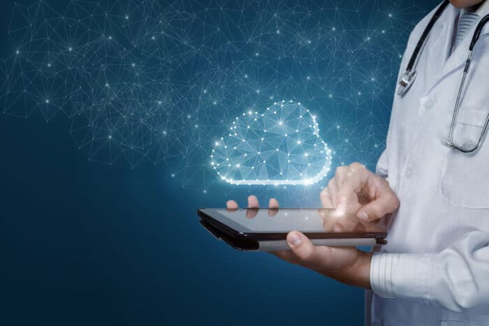 A doctor using a mobile phone with a data overlay.