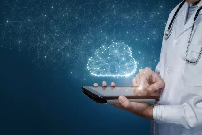 A doctor using a mobile phone with a data overlay.