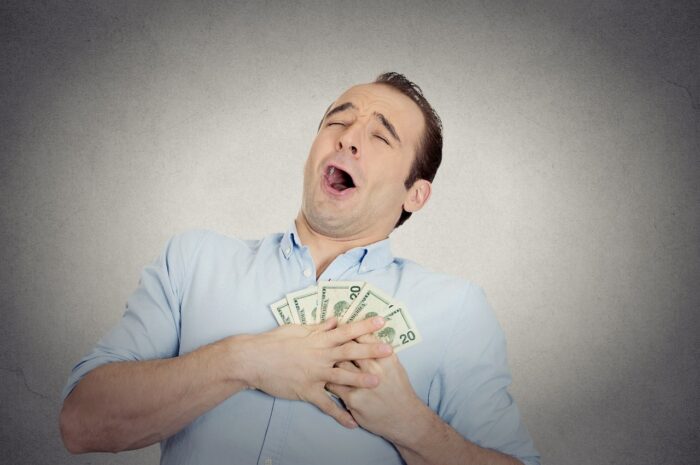 Closeup portrait happy excited man with money