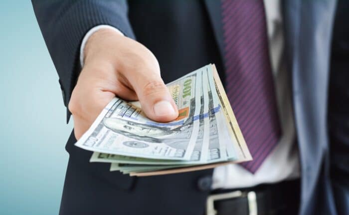 ftc refund giving money, united states dollar (USD) bills, on gray background