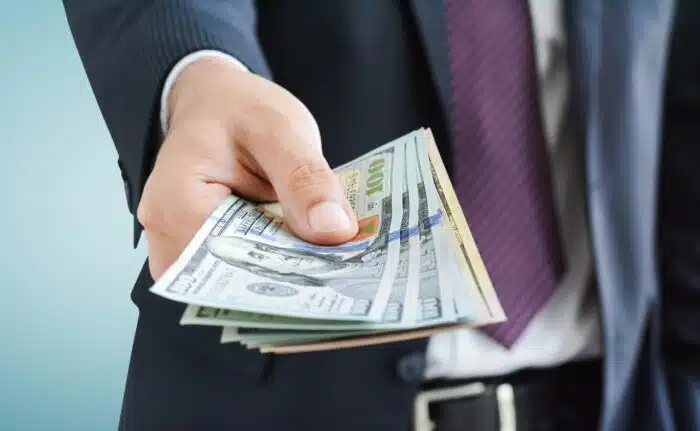 ftc refund giving money, united states dollar (USD) bills, on gray background