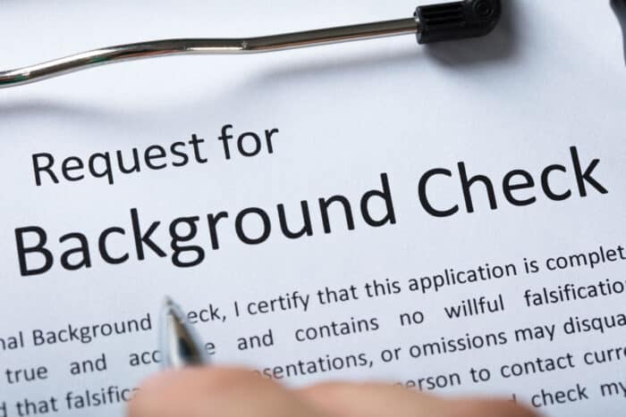 High Angel View Of Criminal Background Check Application Form With Pen.