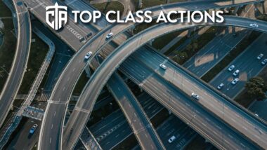 Top up aerial drone view of elevated road and traffic junctions.