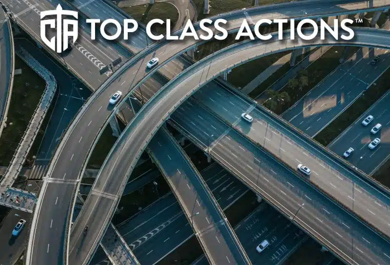 Top up aerial drone view of elevated road and traffic junctions.