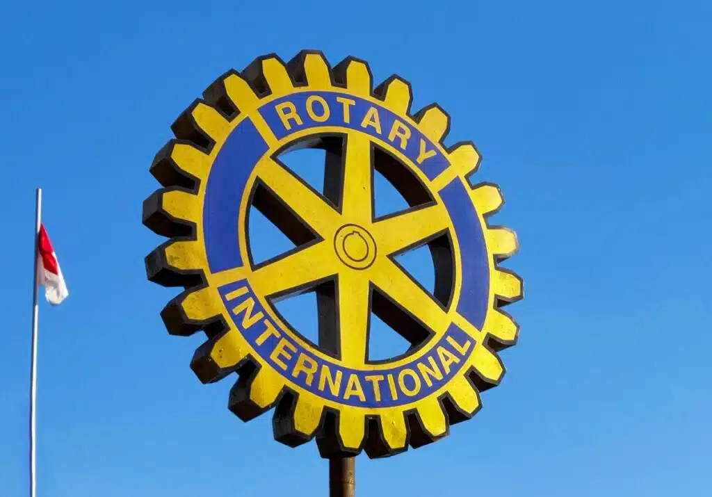 Rotary International sign against a blue sky.