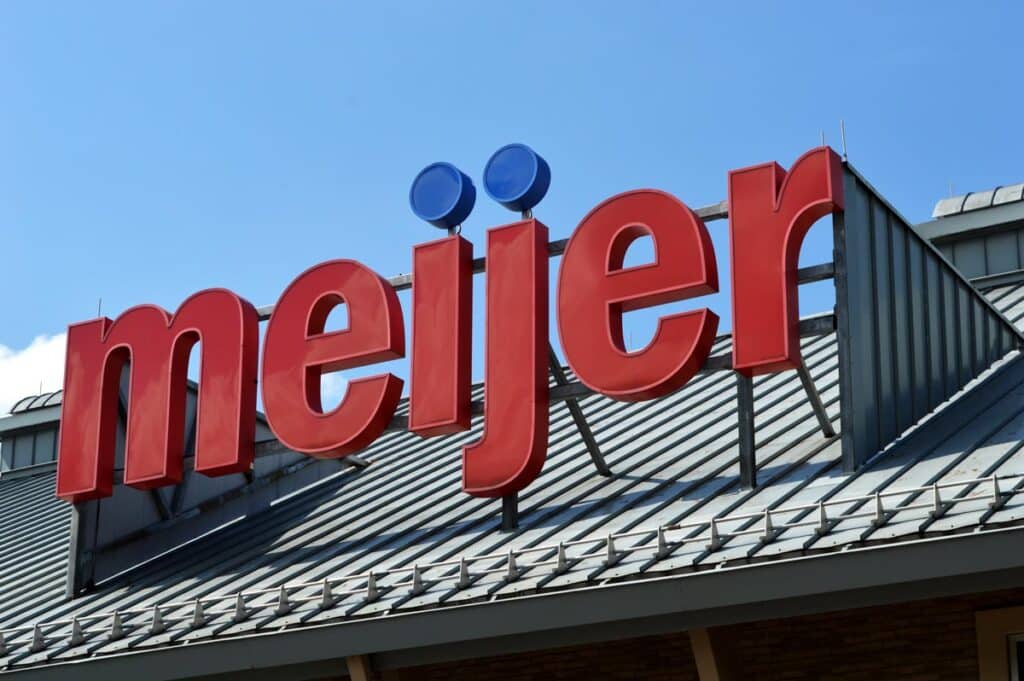 Close up of Meijer signage against a blue sky.