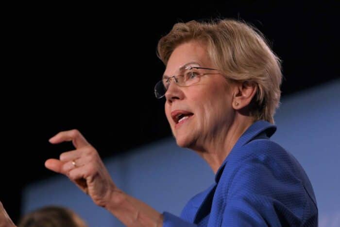 Massachusetts Senator Elizabeth Warren speaks to the crowd at a forum for presidential candidates - zelle fraud